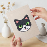 Hand holding a finished Panda and Cat mini canvas