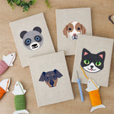The four finished Panda and Cat mini canvases laid out on a table
