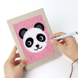 Punching a Panda and Labrador mini canvas with the punch needle
