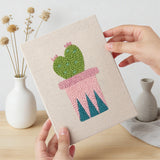 Hand holding a finished Patterned Pot Cacti mini canvas