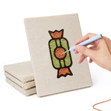 Hand punching one of the Peach Pizza Party mini canvases
