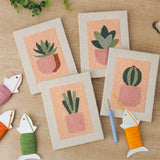 The four finished Peach Succulents mini canvases laid out on a table