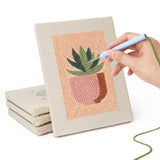 Hand punching one of the Peach Succulents mini canvases