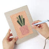 Punching a Peach Succulents mini canvas with the punch needle