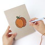 Punching a Pear Peach Pineapple mini canvas with the punch needle