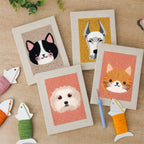 The four finished Pet Portraits mini canvases laid out on a table