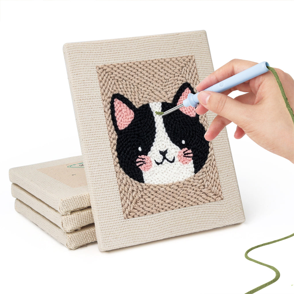 Hand punching one of the Pet Portraits mini canvases