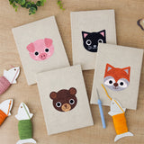 The four finished Piglet and Fox mini canvases laid out on a table