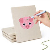Hand punching one of the Piglet and Fox mini canvases
