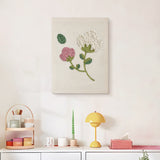 Finished Pink and White Sprig punch needle canvas on a wall