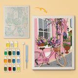 Pink Bicycle Lane canvas before and after punching, with the threads and tools