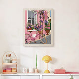 Finished Pink Bicycle Lane punch needle canvas on a wall
