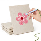 Hand punching one of the Pink Blossom Heads mini canvases