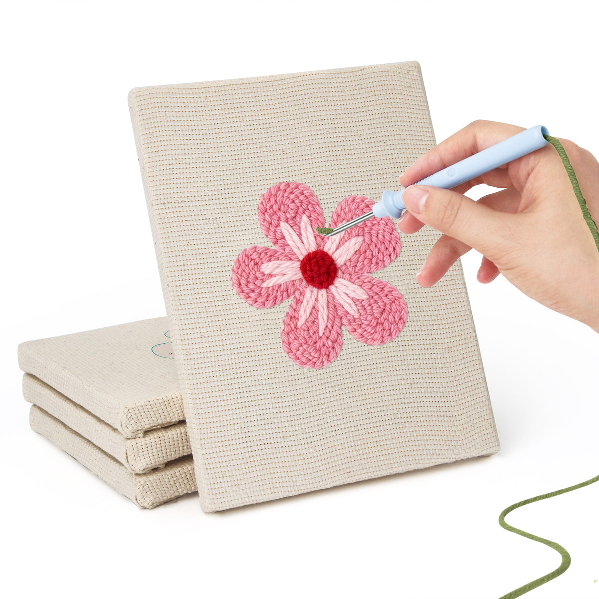 Hand punching one of the Pink Blossom Heads mini canvases