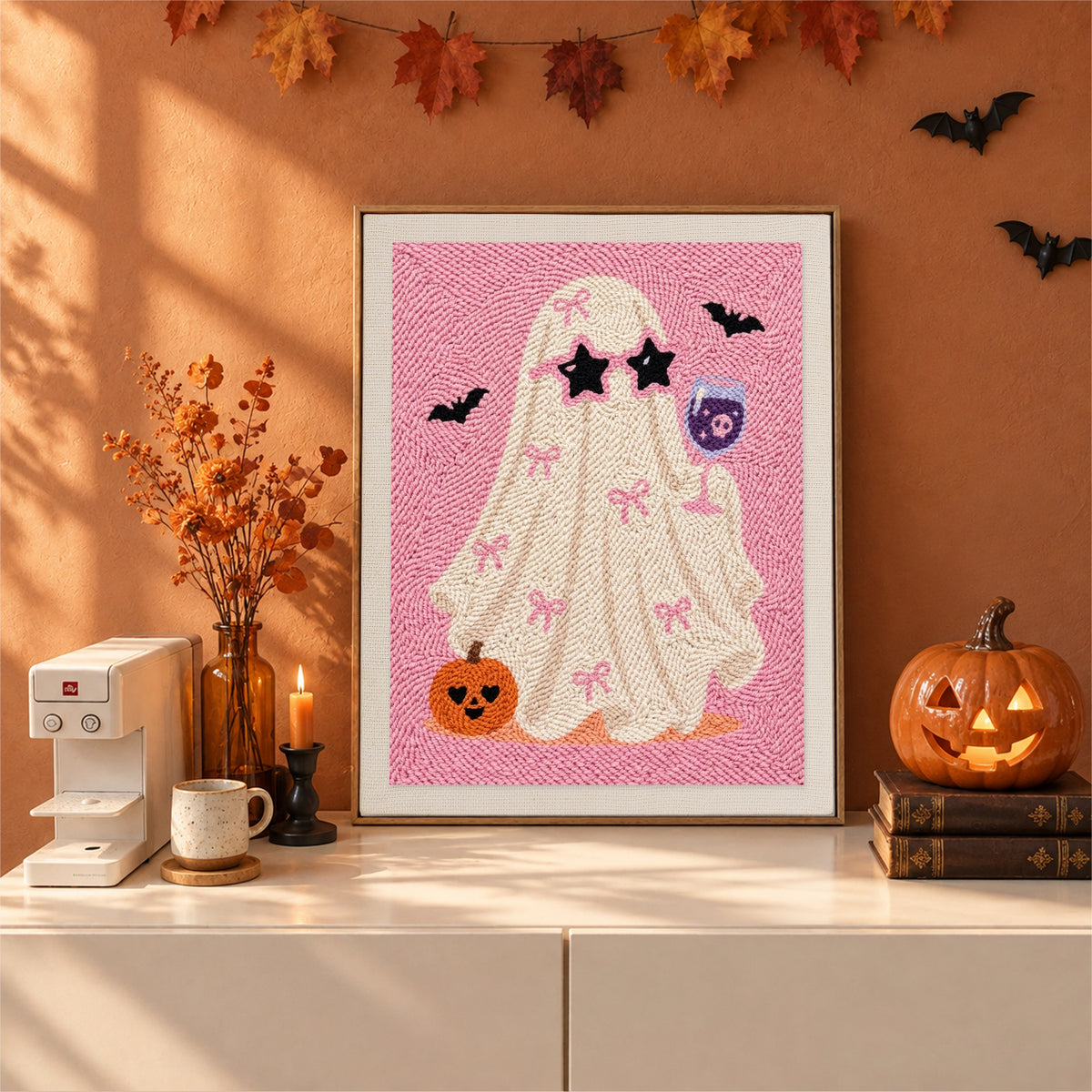 Finished Pink Bow Ghost punch needle canvas on a wall