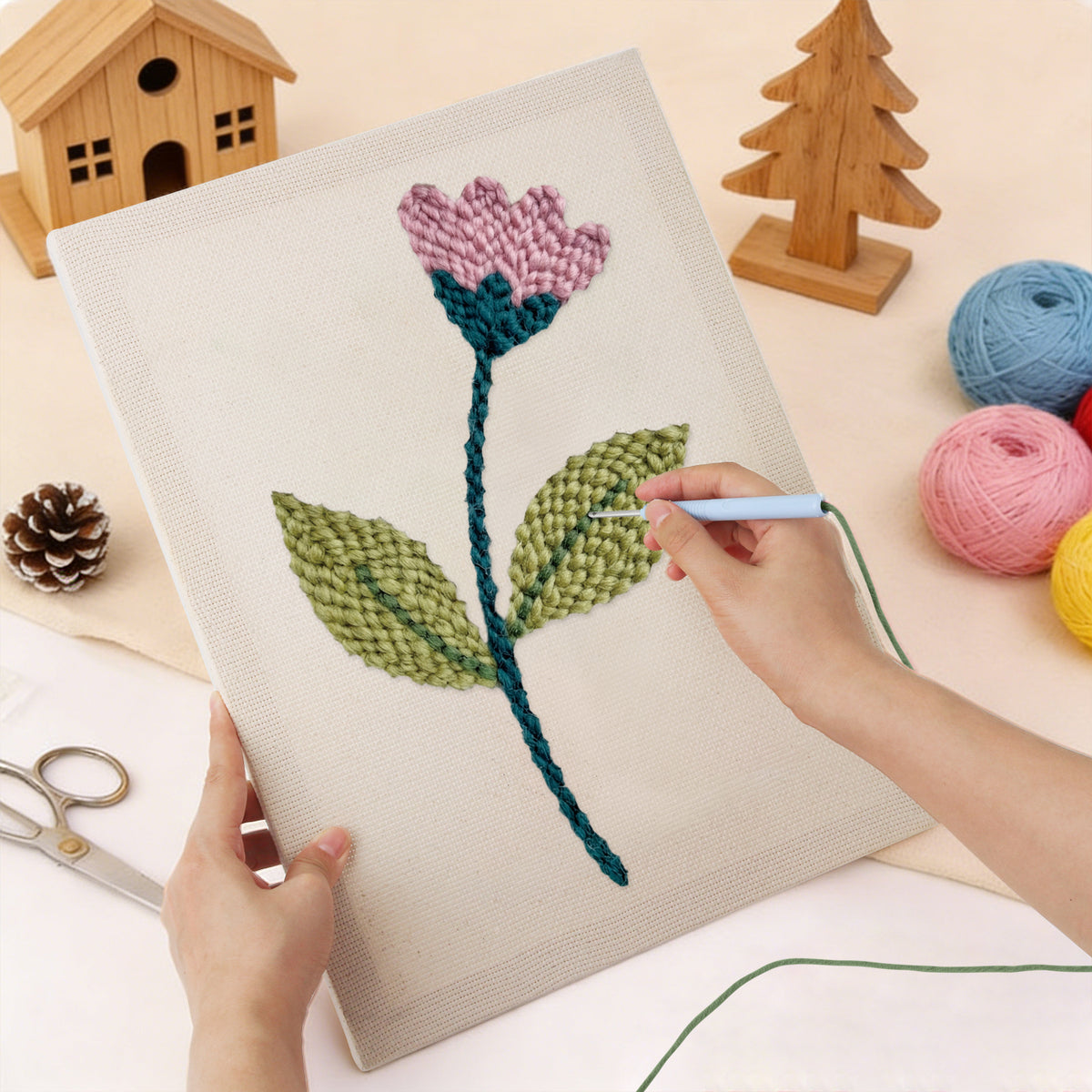 Punching the Pink Bud Stem design with the punch needle