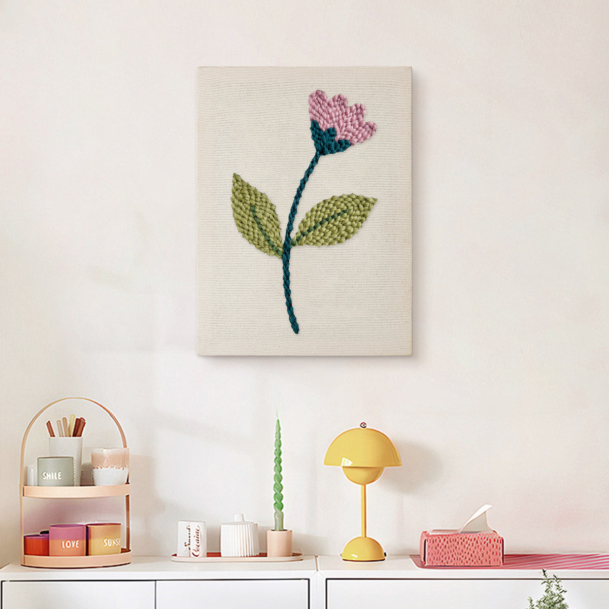 Finished Pink Bud Stem punch needle canvas on a wall