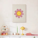 Finished Pink Daisy Head punch needle canvas on a wall