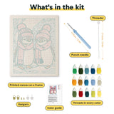 What is in the Pink Hat Penguins kit: printed canvas, punch needle, threader, threads, color guide and hangers