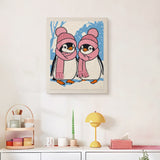 Finished Pink Hat Penguins punch needle canvas on a wall