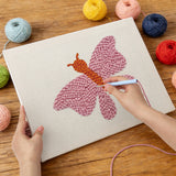 Punching the Pink Moth design with the punch needle