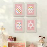The four Pink Pastel Eggs mini canvases on a wall above a shelf
