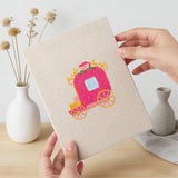Hand holding a finished Pink Princess Day mini canvas