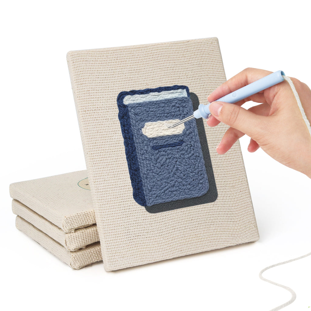 Hand punching one of the Pink School Backpack mini canvases