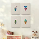 The four Pink Stem Cacti mini canvases on a wall above a shelf
