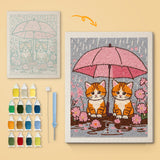 Pink Umbrella Cats canvas before and after punching, with the threads and tools