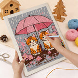 Punching the Pink Umbrella Cats design with the punch needle