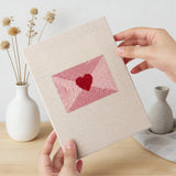 Hand holding a finished Pink Valentine Hearts mini canvas