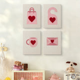 The four Pink Valentine Hearts mini canvases on a wall above a shelf