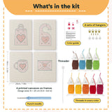 What is in the Pink Valentine Hearts set, 8 × 12 in (20 × 30 cm) each: 4 printed canvases, punch needle, threader, threads, color guide and 4 sets of hangers