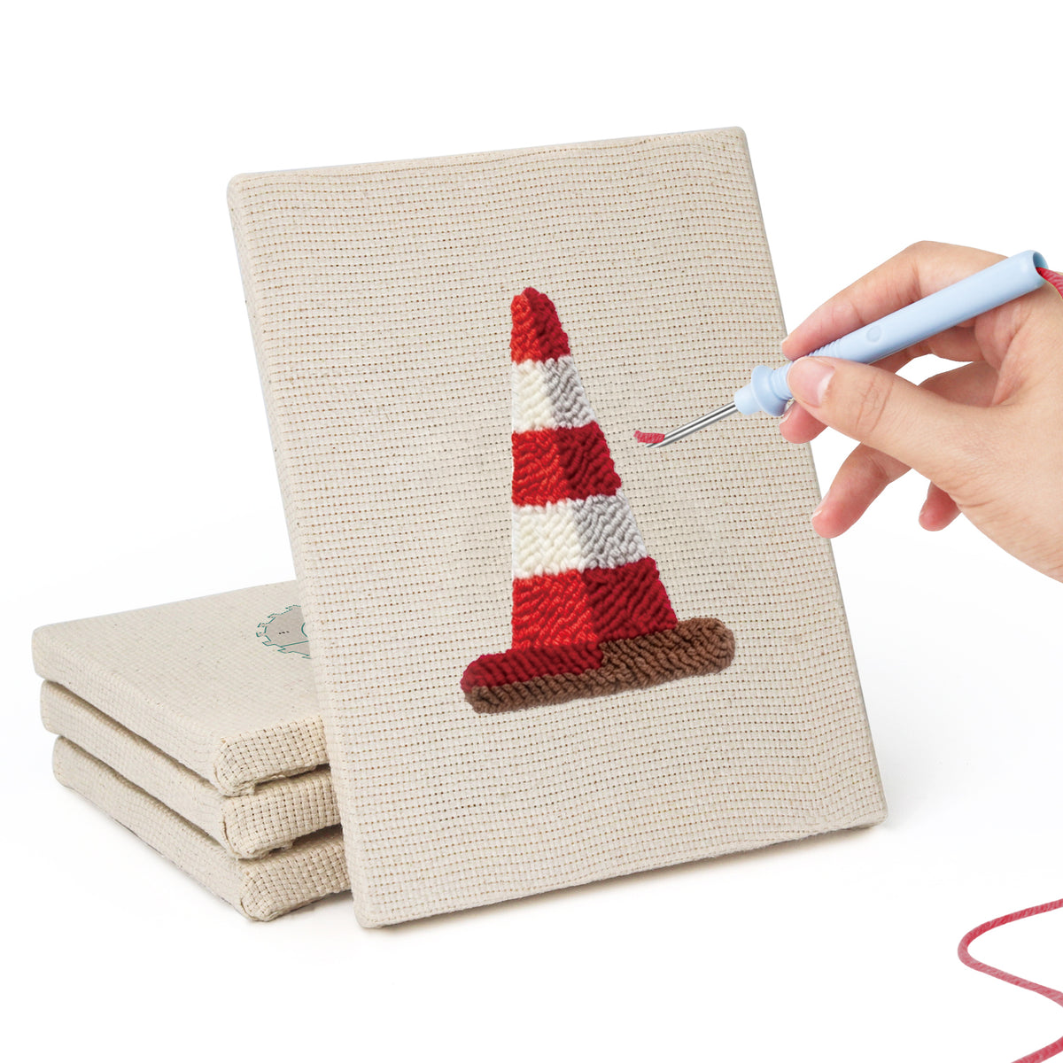 Hand punching one of the Pit Crew Trophy mini canvases