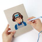 Punching a Pit Crew Trophy mini canvas with the punch needle