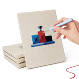 Hand punching one of the Podium Race Car mini canvases