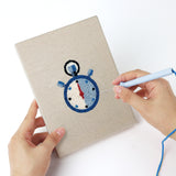 Punching a Podium Race Car mini canvas with the punch needle