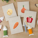 The four finished Potato and Onion mini canvases laid out on a table