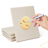 Hand punching one of the Potato and Onion mini canvases