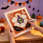 Punching the Potion Flower design with the punch needle