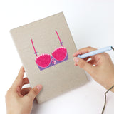 Punching a Pretty Pink Bras mini canvas with the punch needle
