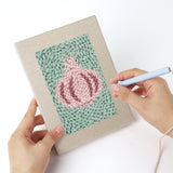 Punching a Pumpkin and Corn mini canvas with the punch needle