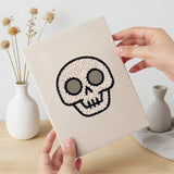 Hand holding a finished Pumpkin and Skull mini canvas