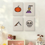 The four Pumpkin and Skull mini canvases on a wall above a shelf