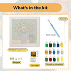 What is in the Pumpkin Bouquet Cat kit: printed canvas, punch needle, threader, threads, color guide and hangers