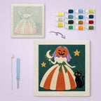 Pumpkin Bride canvas before and after punching, with the threads and tools