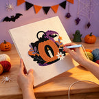 Punching the Pumpkin Candle Lantern design with the punch needle