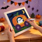 Punching the Pumpkin Carriage Ghost design with the punch needle