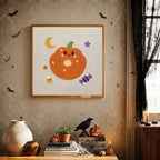 Finished Pumpkin Donut punch needle canvas on a wall